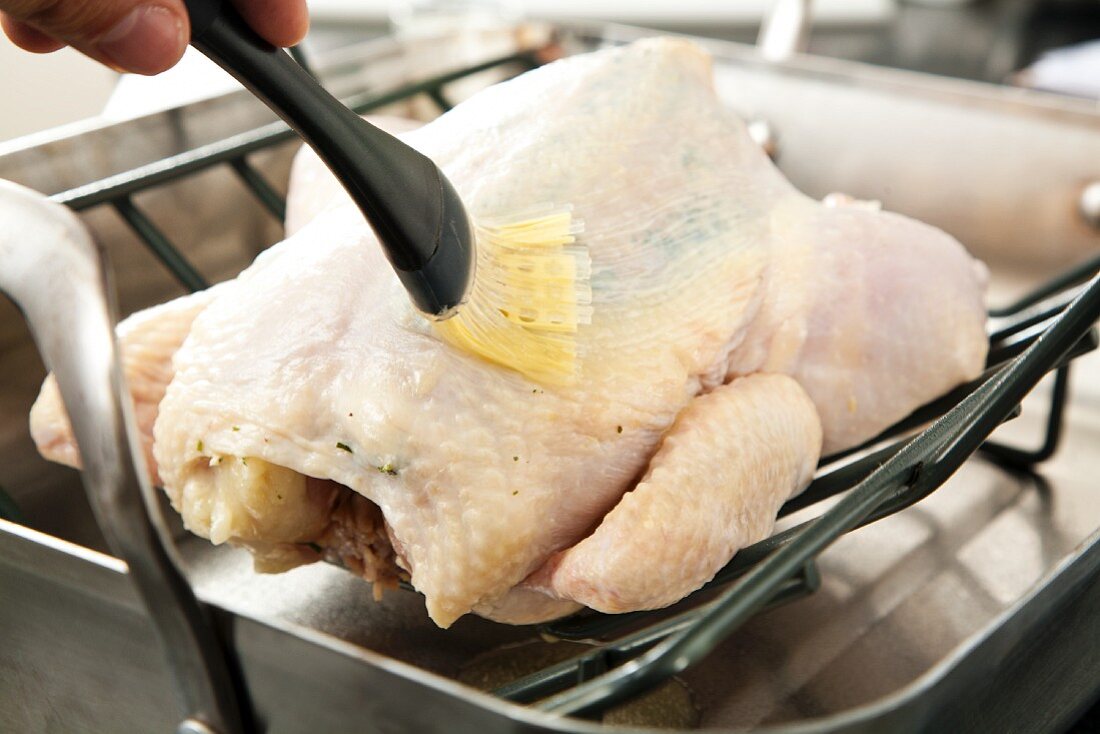 Brushing a Whole Roast Chicken with Butter
