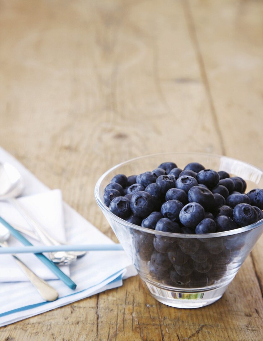 Fresh blueberries in a glass dish