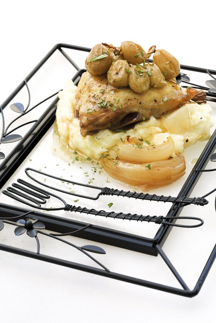 Chicken with roasted grapes on mashed potato