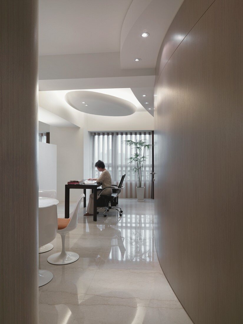 Woman working at desk in modern home