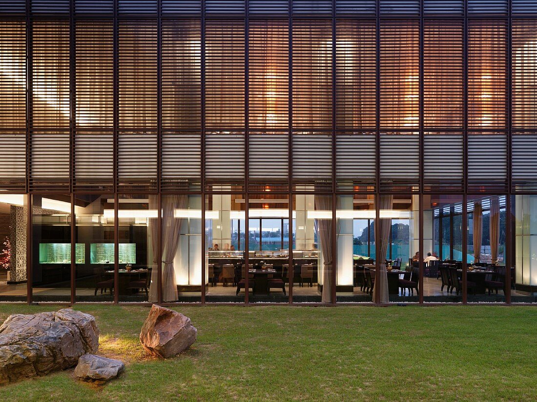 Exterior view dining room with floor to ceiling windows