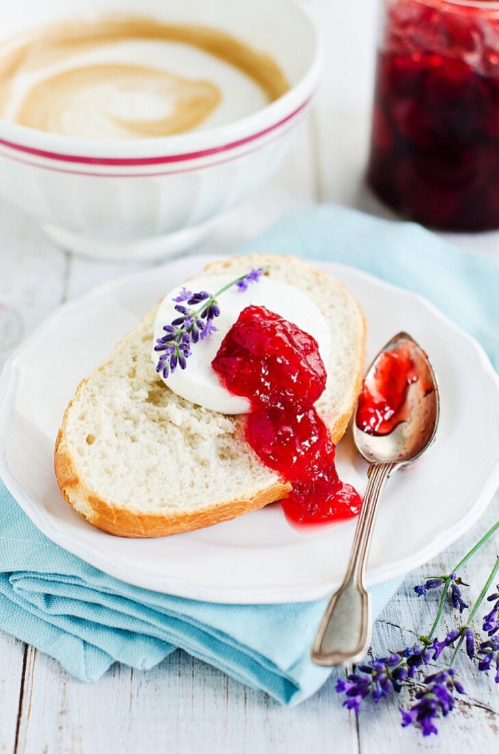 Bread topped with goat's cheese and strawberry jam