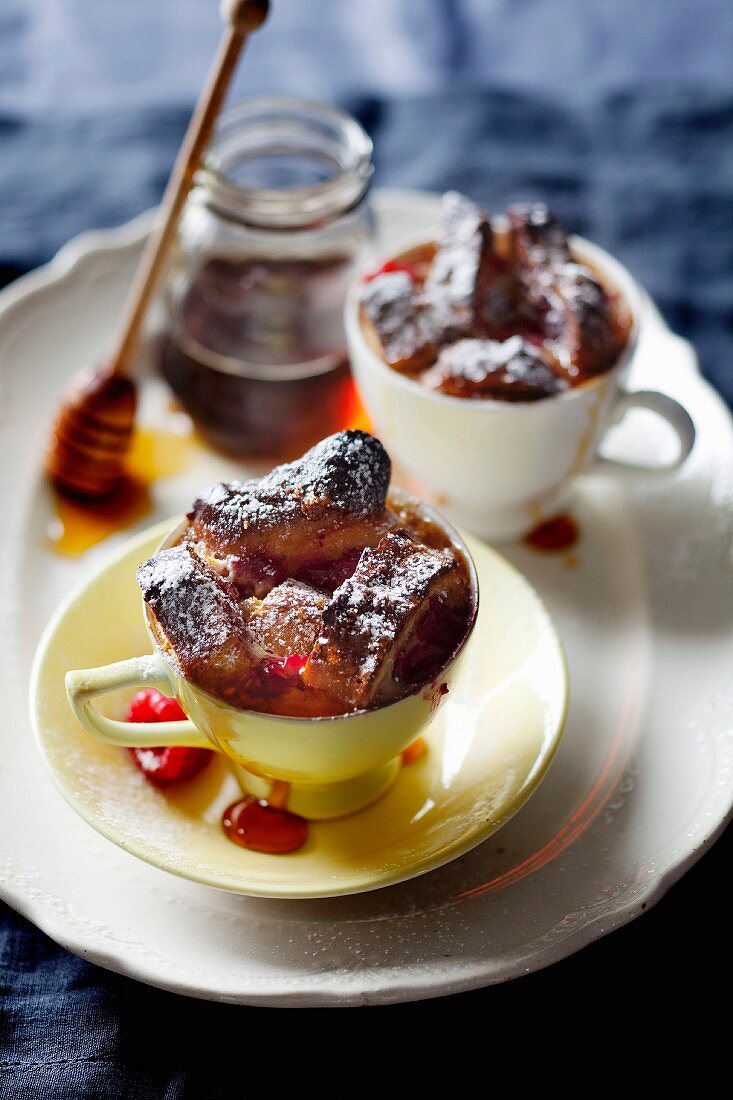 Baked brioche pudding with maple syrup and raspberries