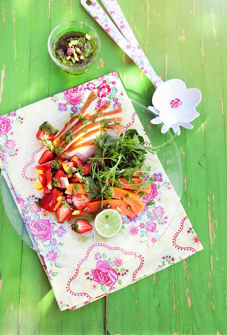 Papaya salad with smoked chicken and pistachio pesto