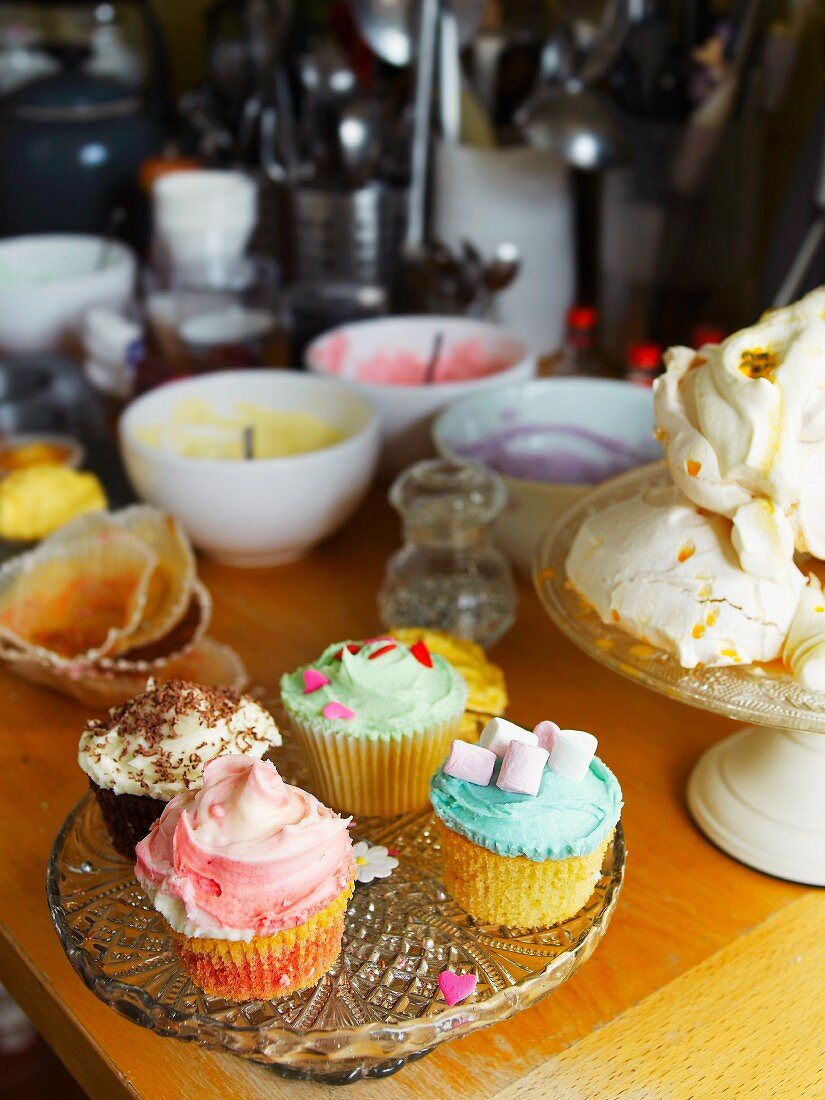 Decorated cupcakes and meringues in a kitchen