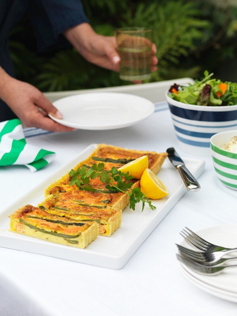 Asparagus and salmon tart on a garden table