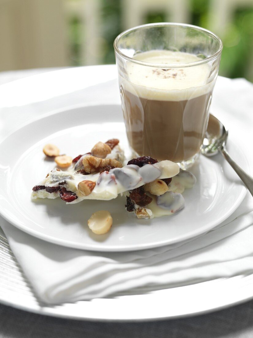White chocolate with dried fruit and nuts with a coffee