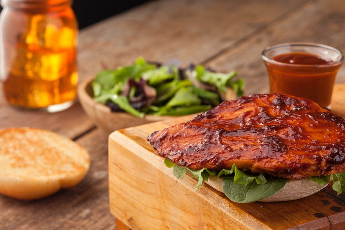 Barbecue Chicken Sandwich; Salad; Iced Tea in a Mason Jar