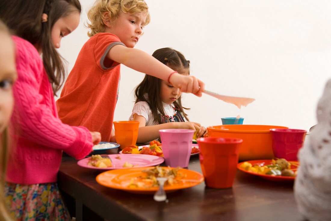 Children eating together at table