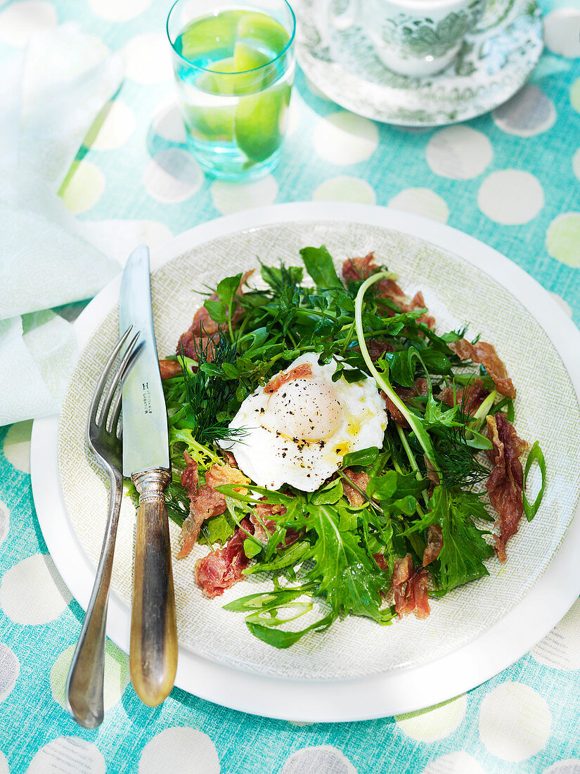 Watercress salad with crispy prosciutto and a poached egg