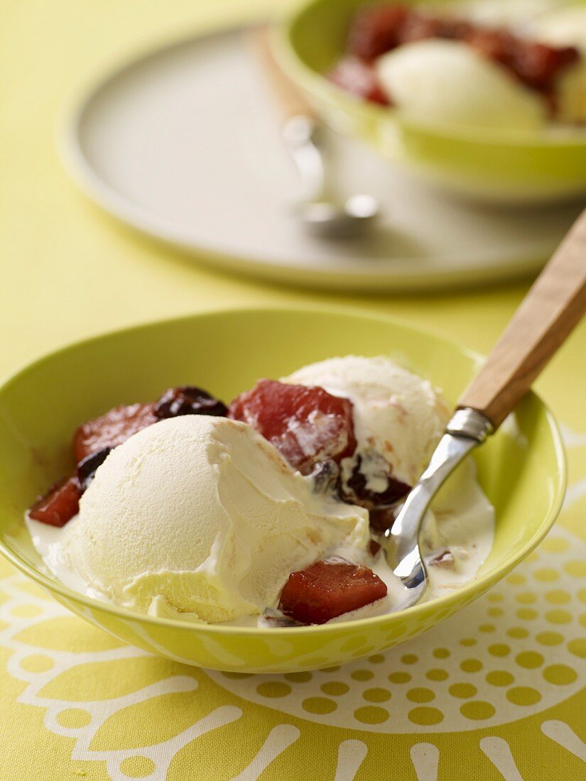 Bowls of Vanilla Ice Cream with Fruit Topping; Spoon