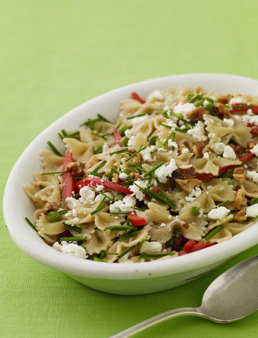 Bowtie Pasta Salad with Feta Cheese, Red Bell Peppers and Walnuts; In a Serving Bowl