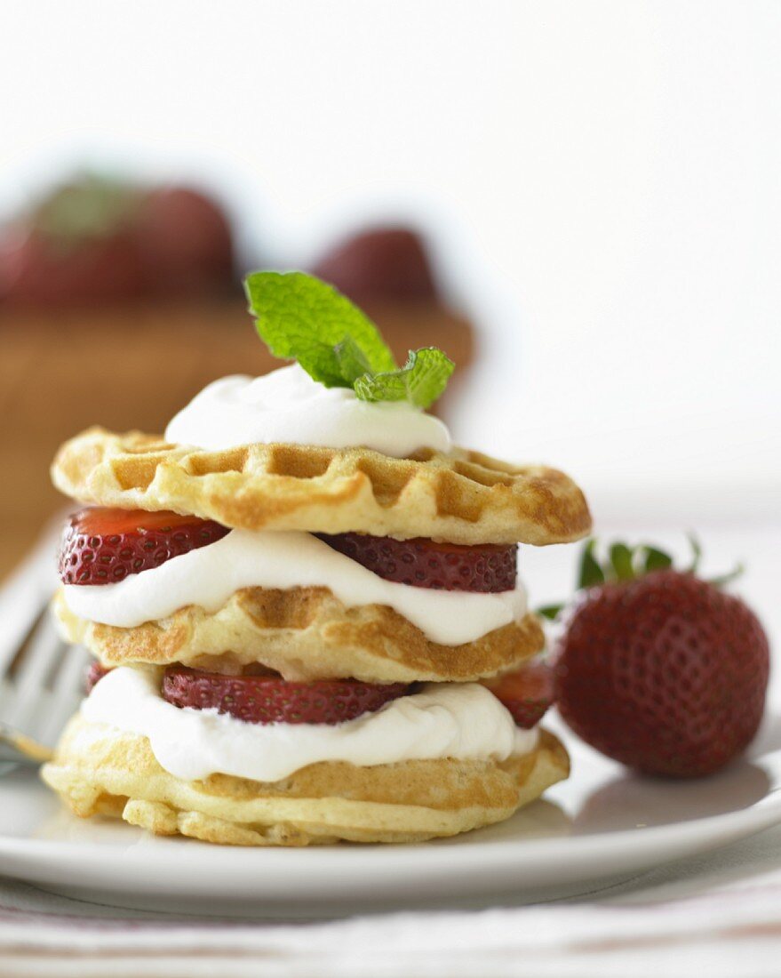 Waffles with strawberries and cream