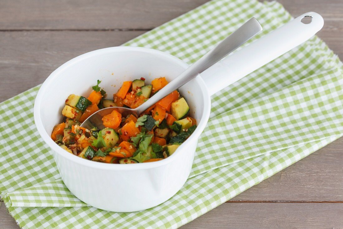 Steamed vegetables: courgette, spring onions, orange pepper