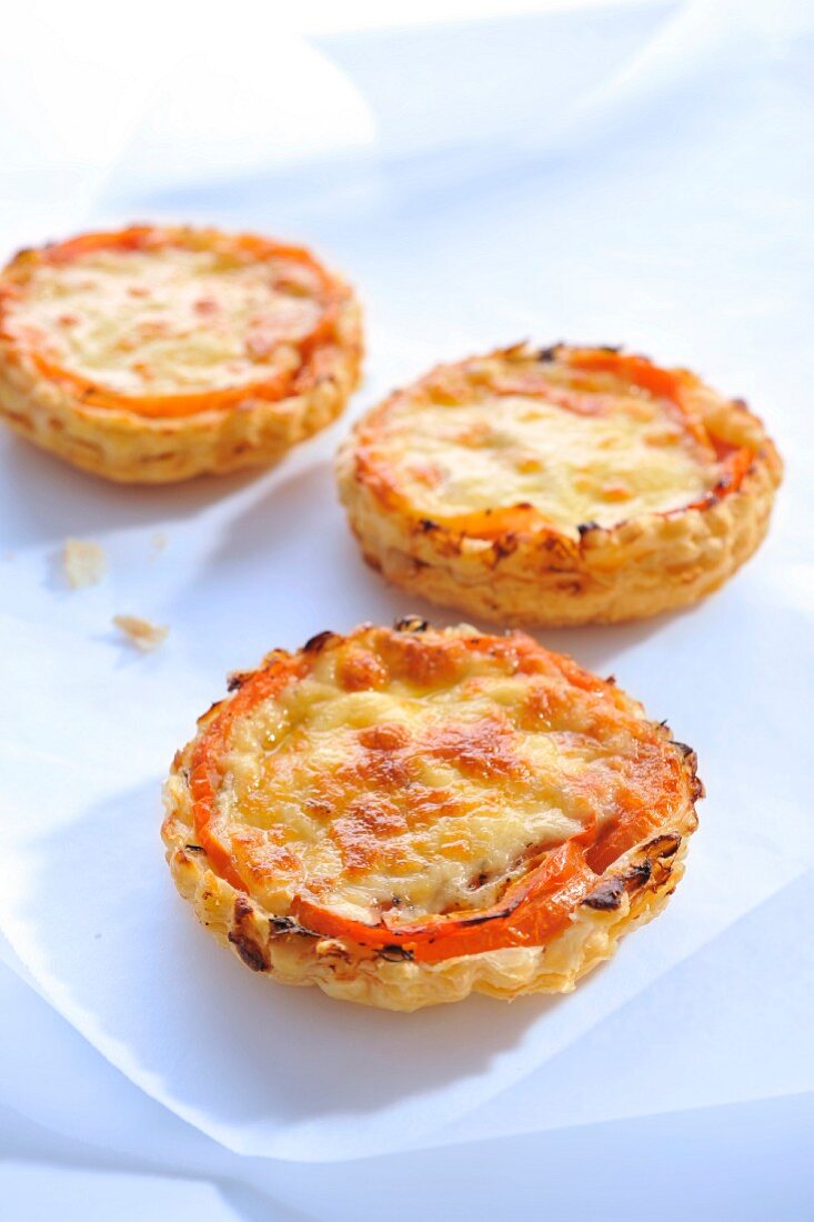 Twice-baked tomato and cheese tartlets