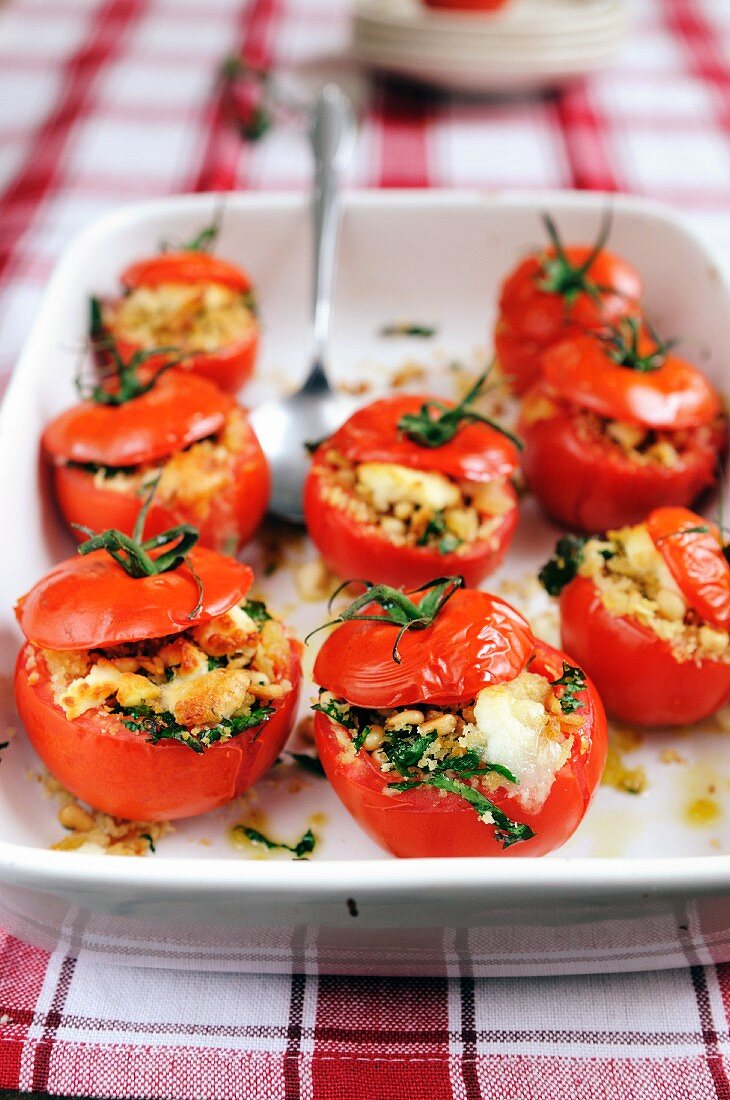 Tomatoes filled with goat's cheese, croutons, parsley and pine nuts