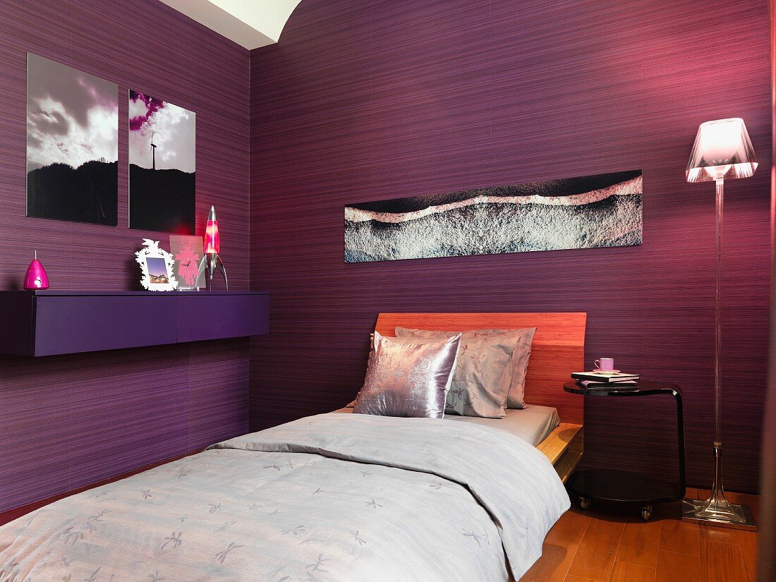 Modern bedroom with purple walls