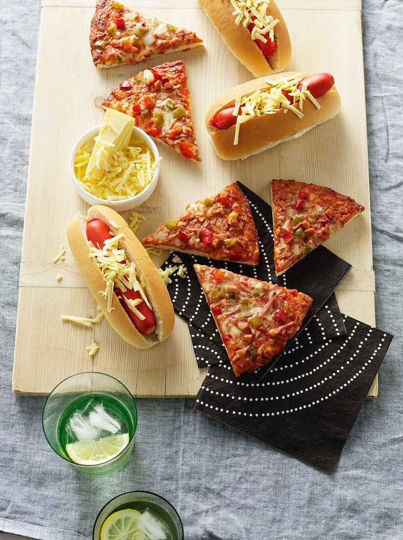Platter with pizza, hot dogs and cheese