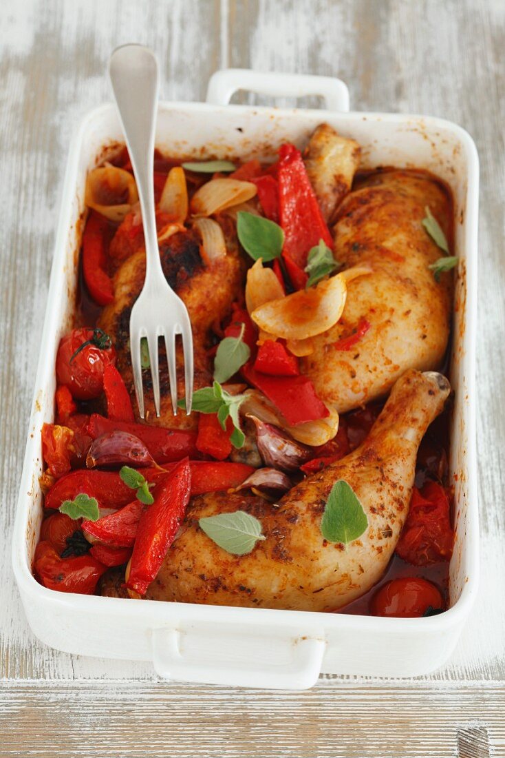 Chicken legs with peppers and tomatoes