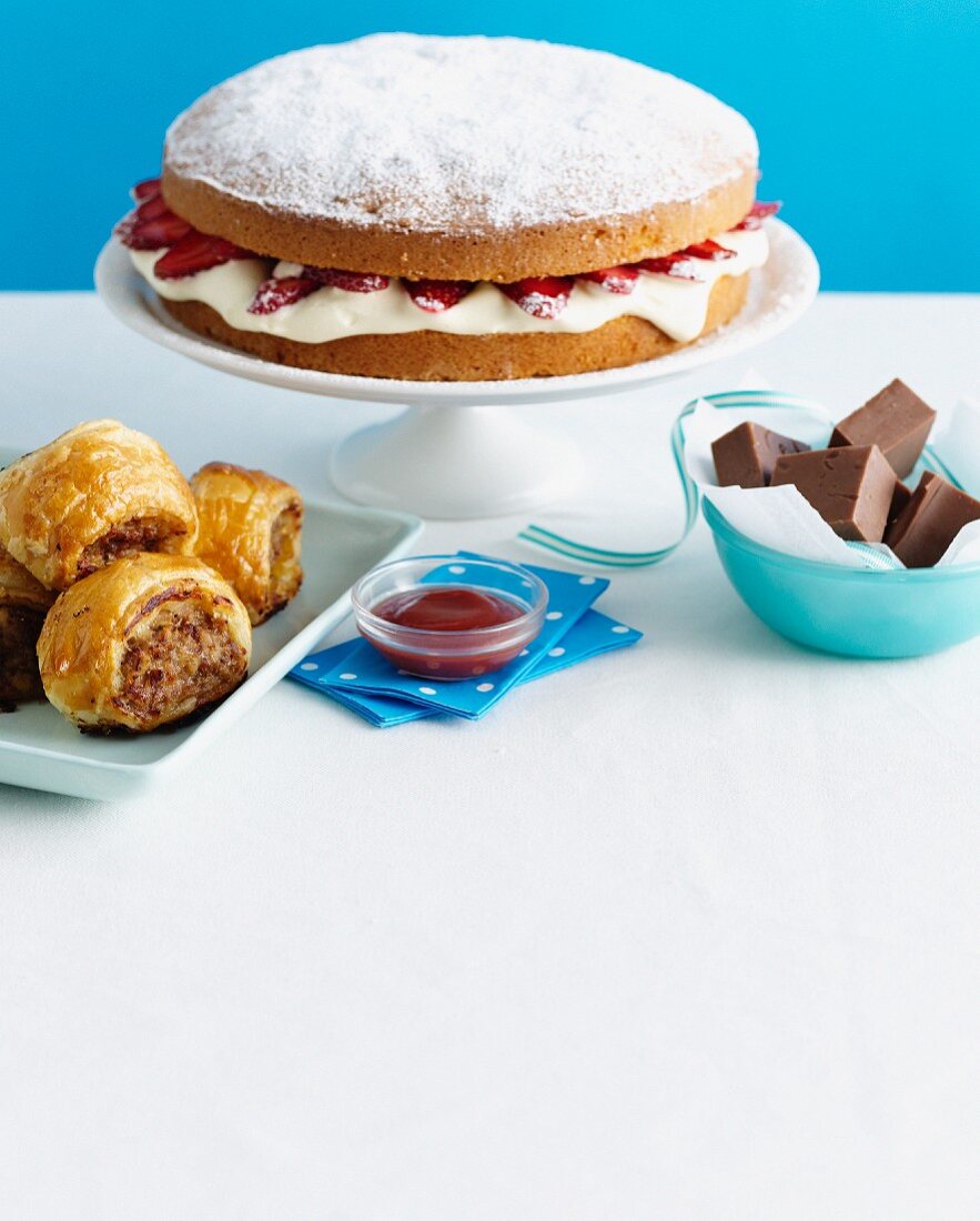 Cake, baklava and chocolate on table