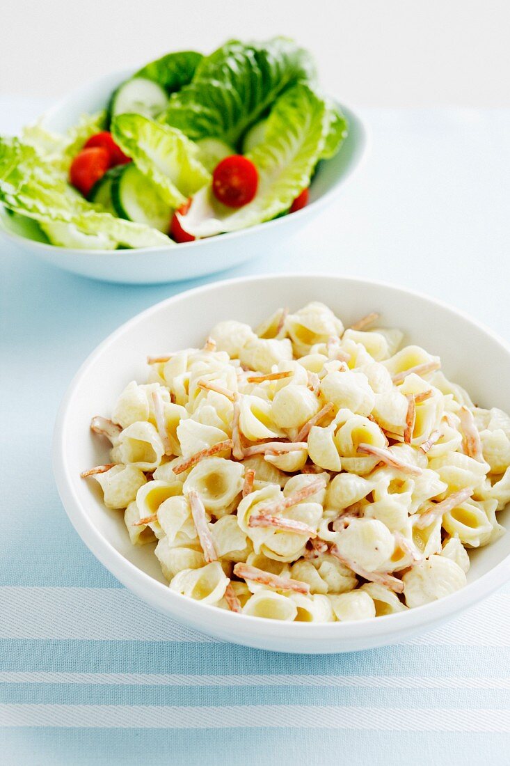 Bowls of pasta and salad