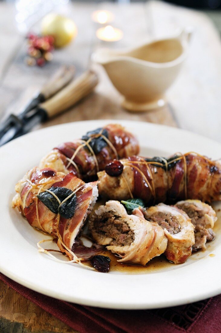 Turkey breast filled with sausage and chestnut puree wrapped in pancetta and sage leaves