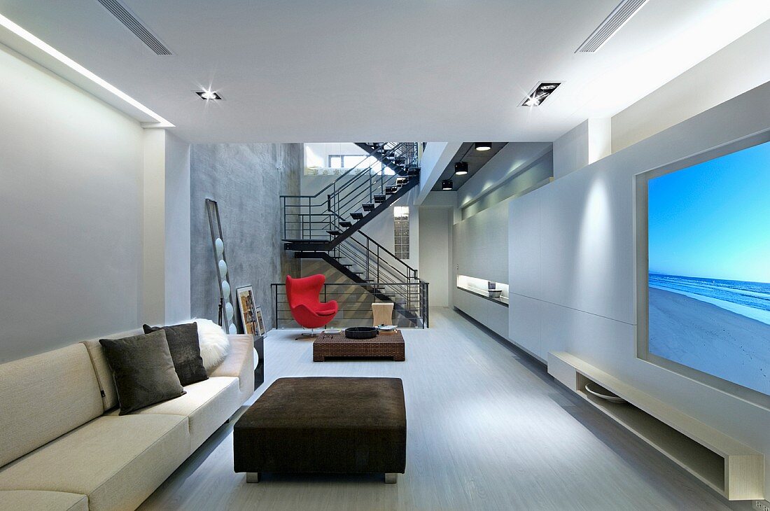 Minimalistic living room with red accent chair