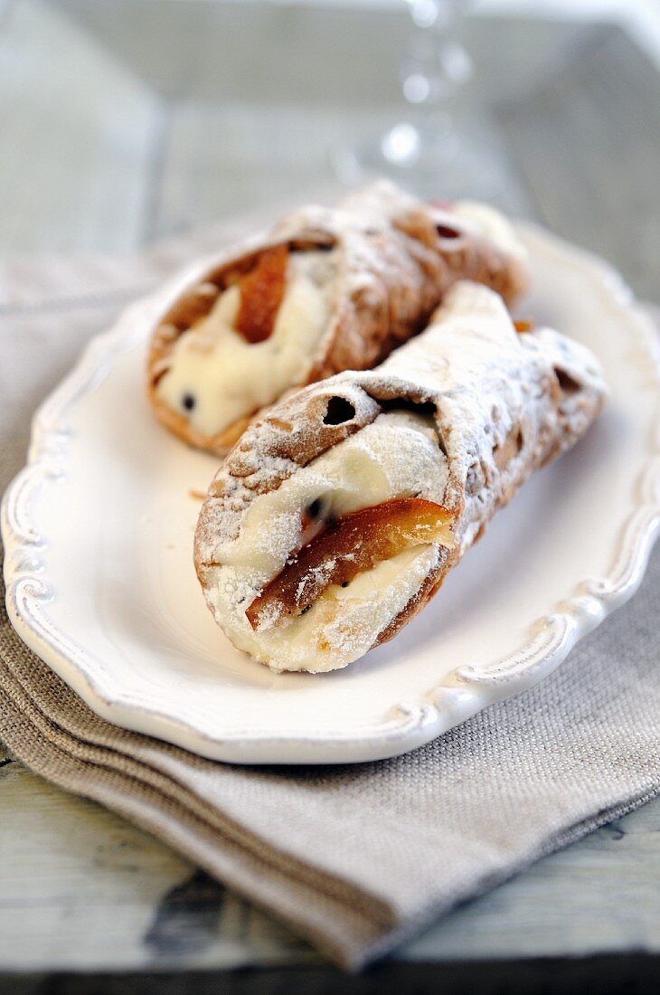 Cannoli (deep fried pastry rolls filled with ricotta cream, Italy)