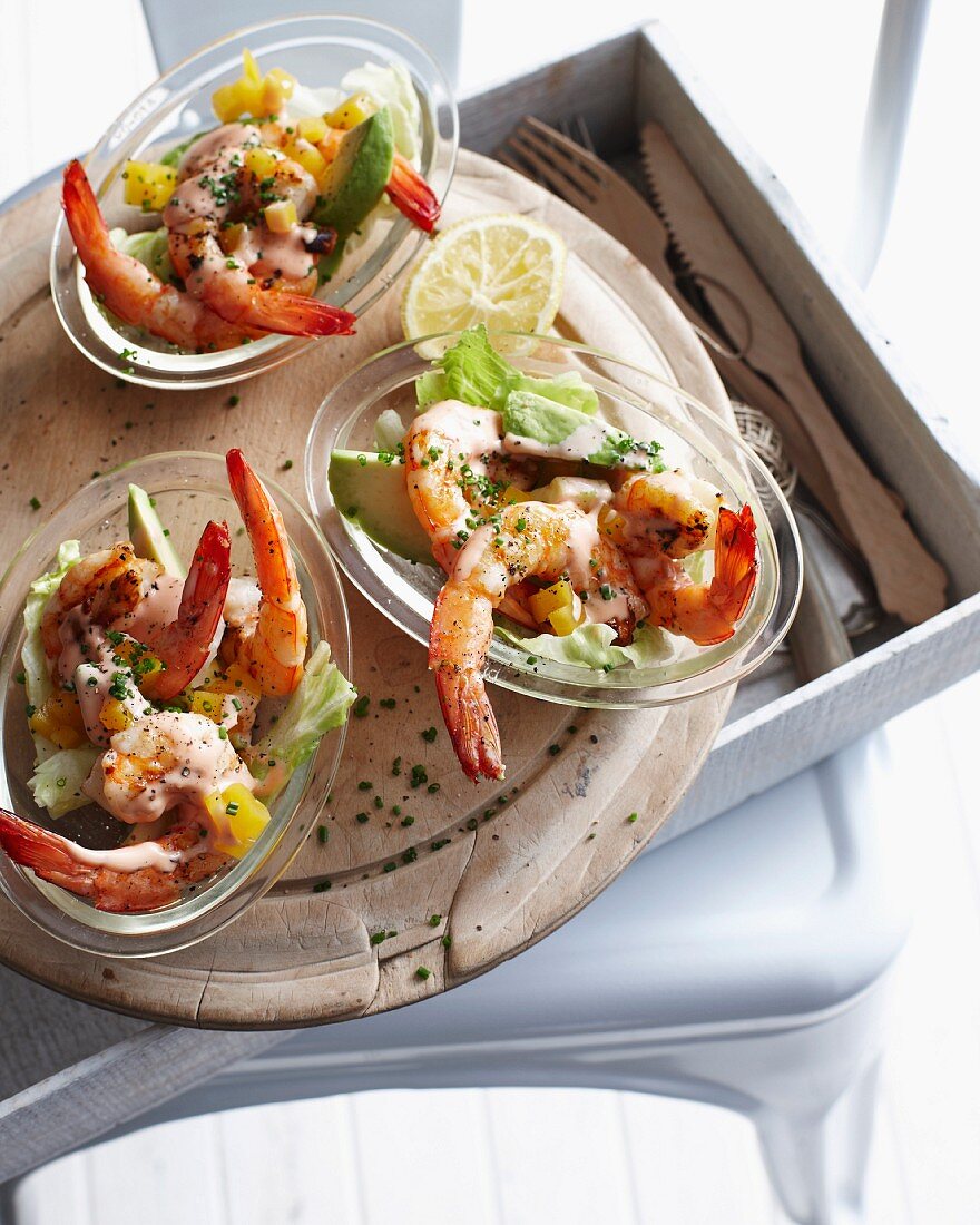 Bowls of prawn cocktail on platter