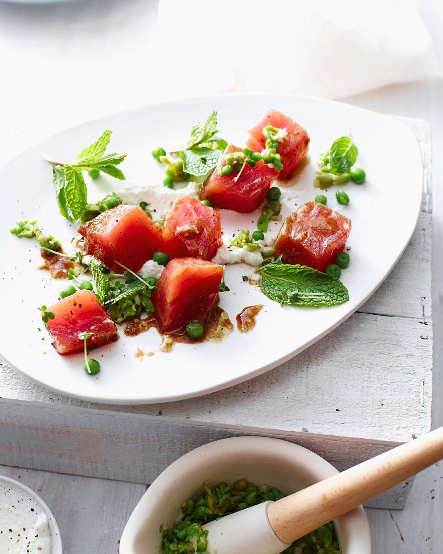 Platter of tuna tartar and crushed peas