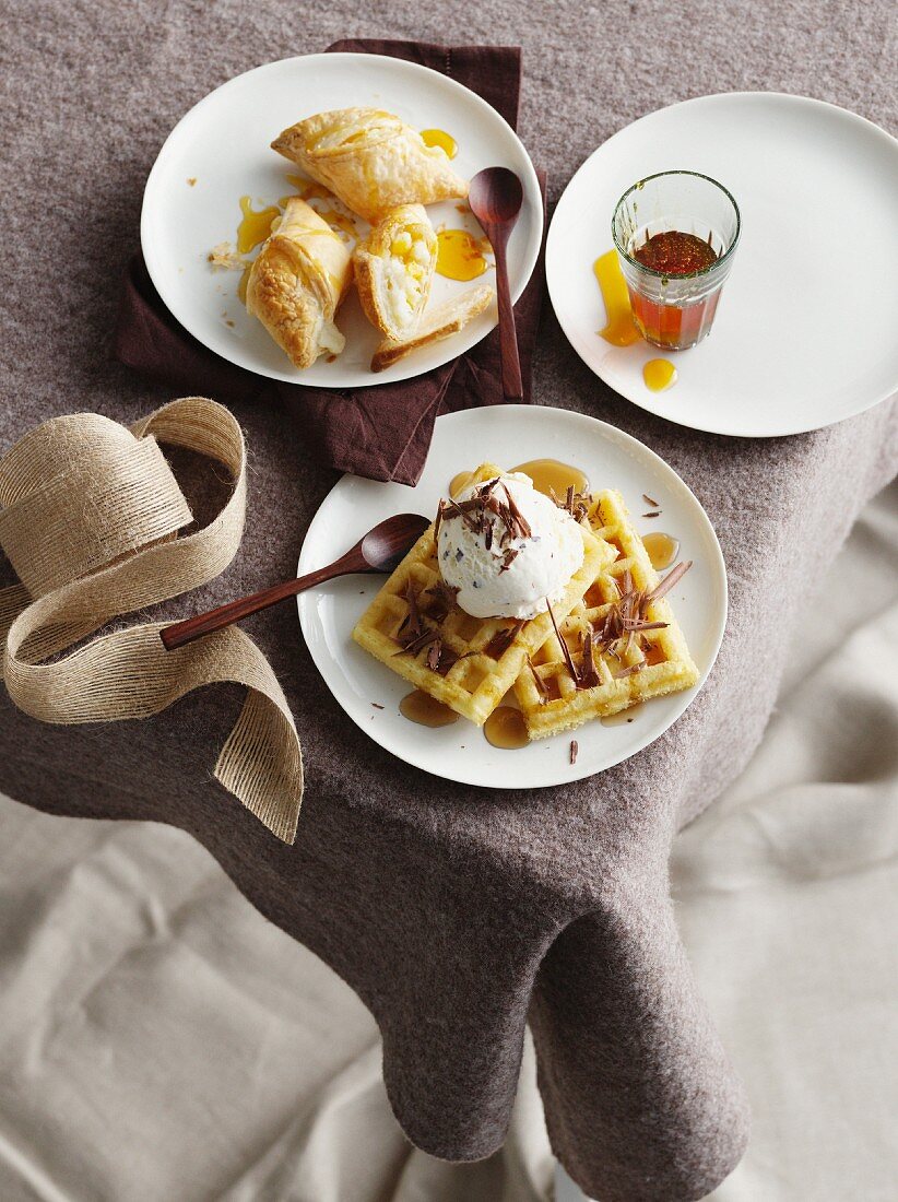 Plates of waffles and pastries