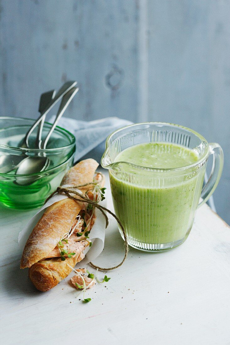 Jug of cucumber trout soup with sandwich