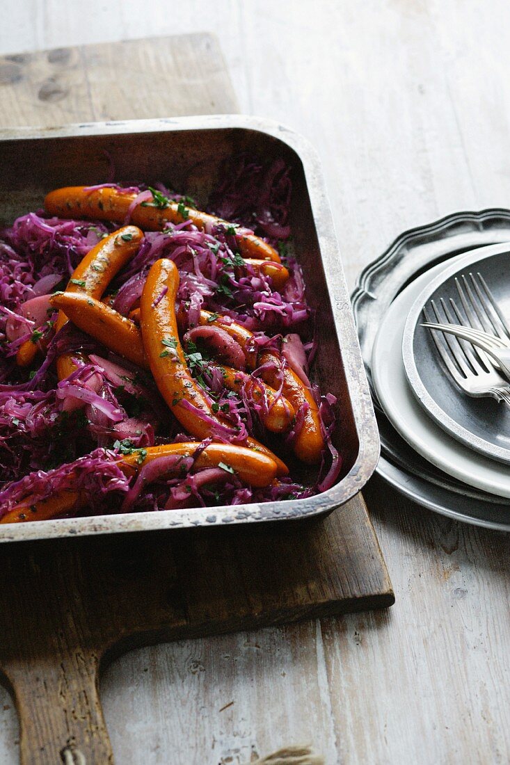 Dish of purple cabbage and frankfurters