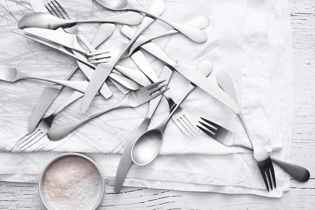 Silverware and flour on table