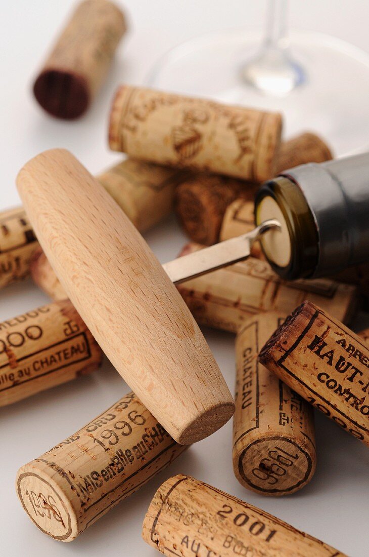 A corkscrew and corks