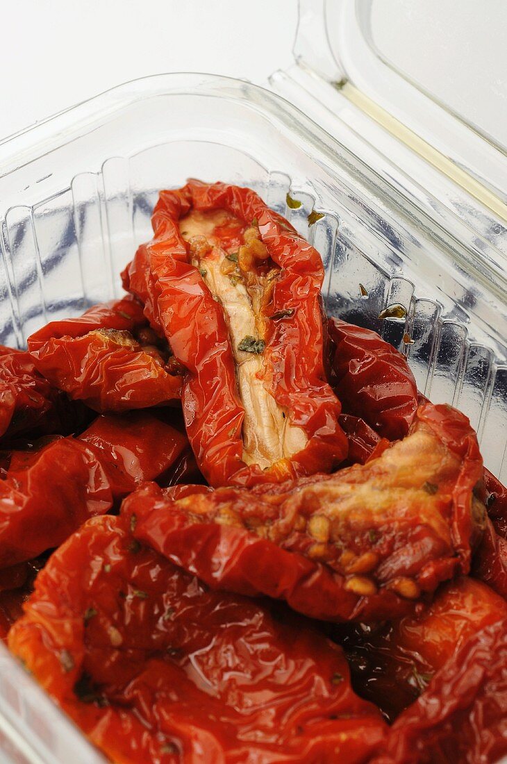Dried tomatoes in a plastic container