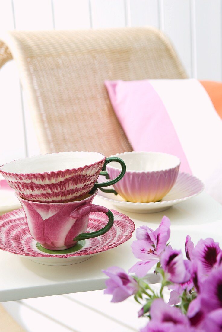Elegant teacups on sunny table