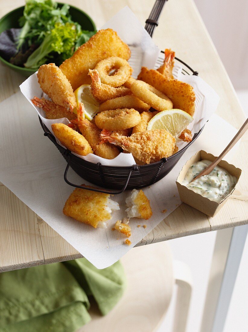 Bowl of onion rings and fried prawns