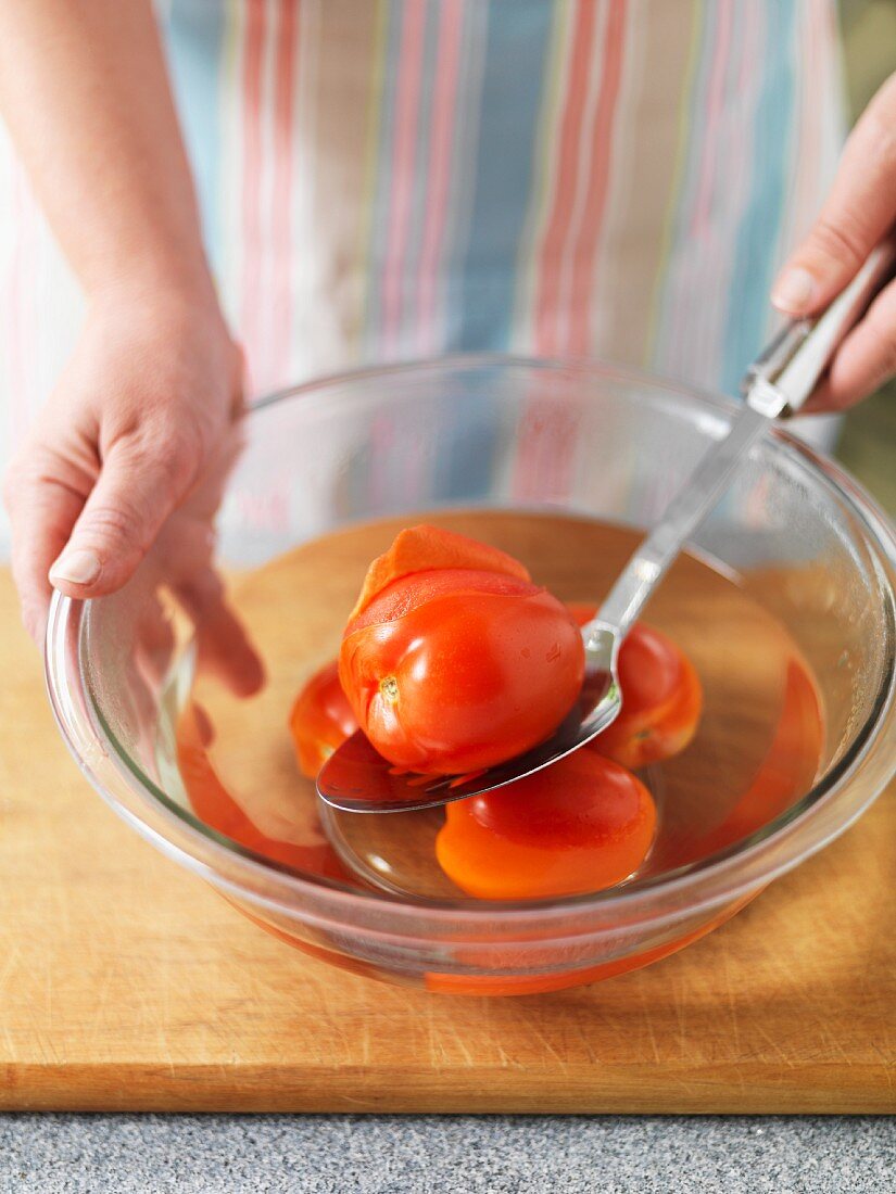 Tomatoes being peeled