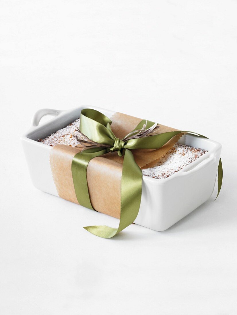 A Pound Cake in a Ceramic Loaf Pan and Tied with a Ribbon