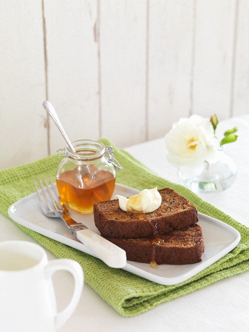 Banana bread with butter and honey