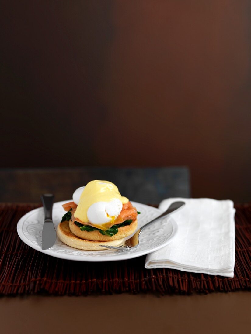 An English muffin with a poached egg and Hollandaise sauce