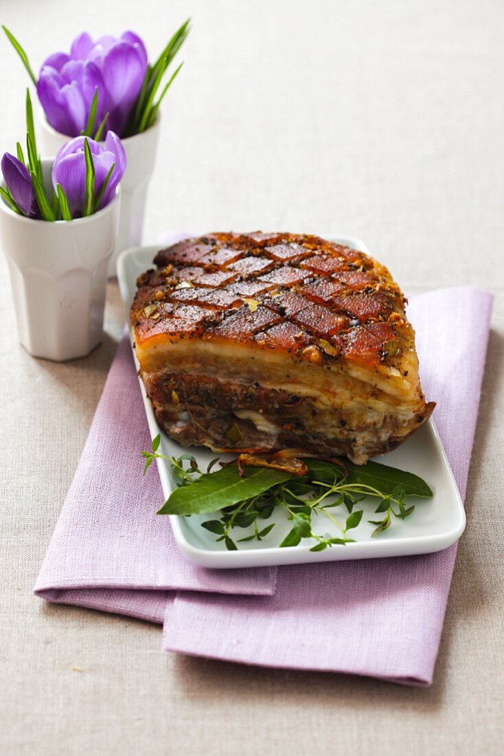 Roast pork belly with fresh herbs