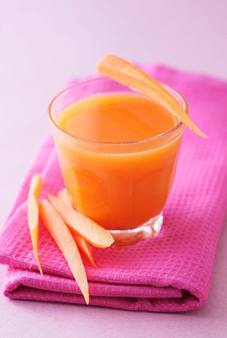 A glass of carrot and apple juice