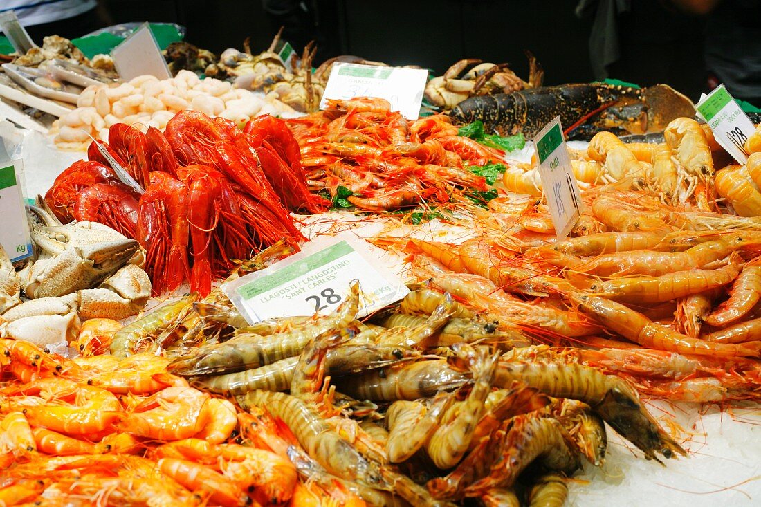 Shrimp, Langostino, Lobster, Crabs on Ice at the La Boqueria Market in Barcelona, Spain