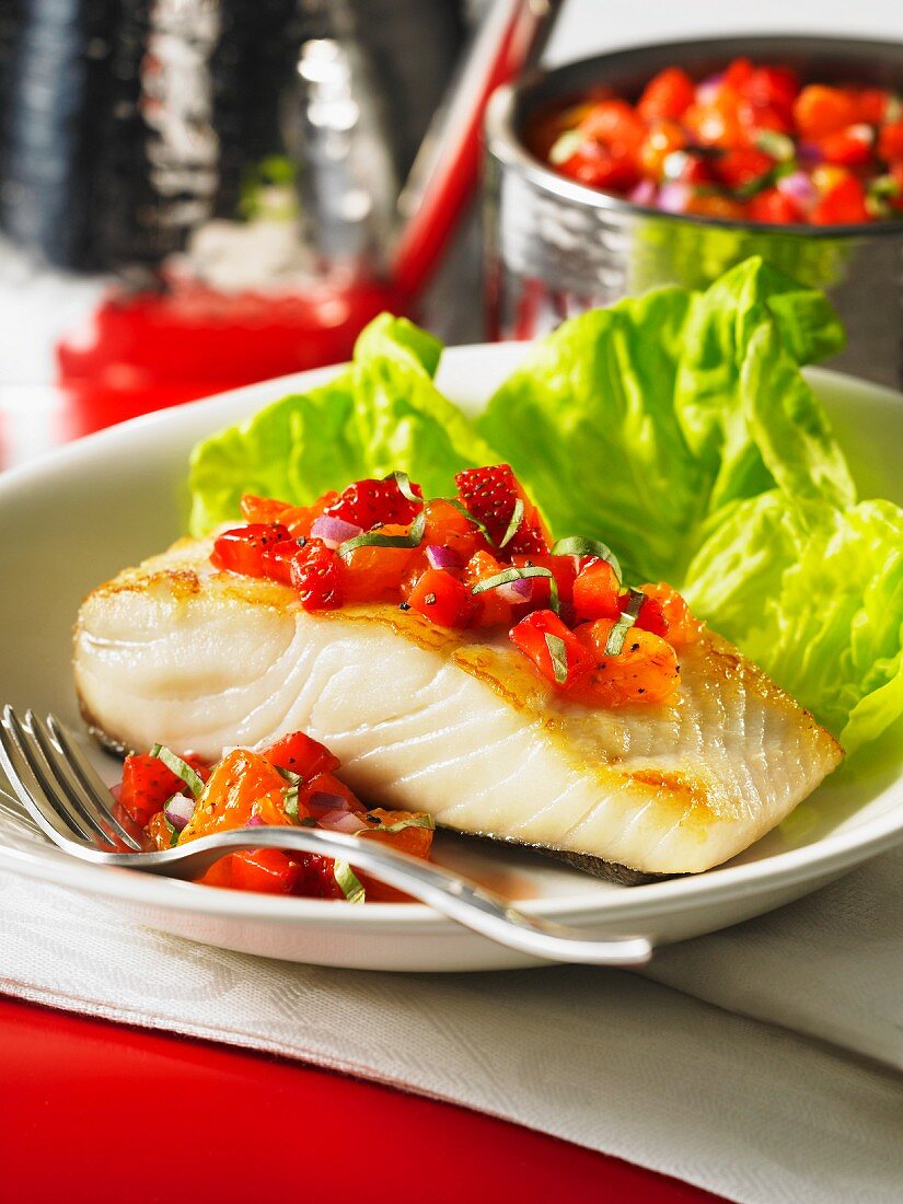 Fried halibut fillet with strawberry salsa