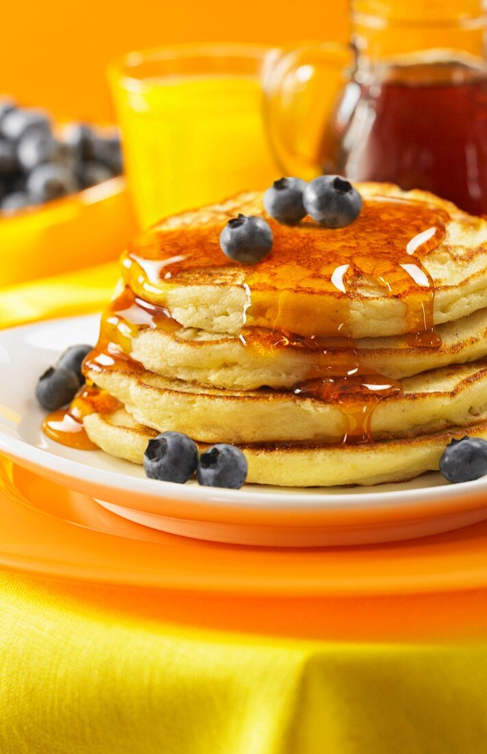 Lemon ricotta pancakes with maple syrup and blueberries