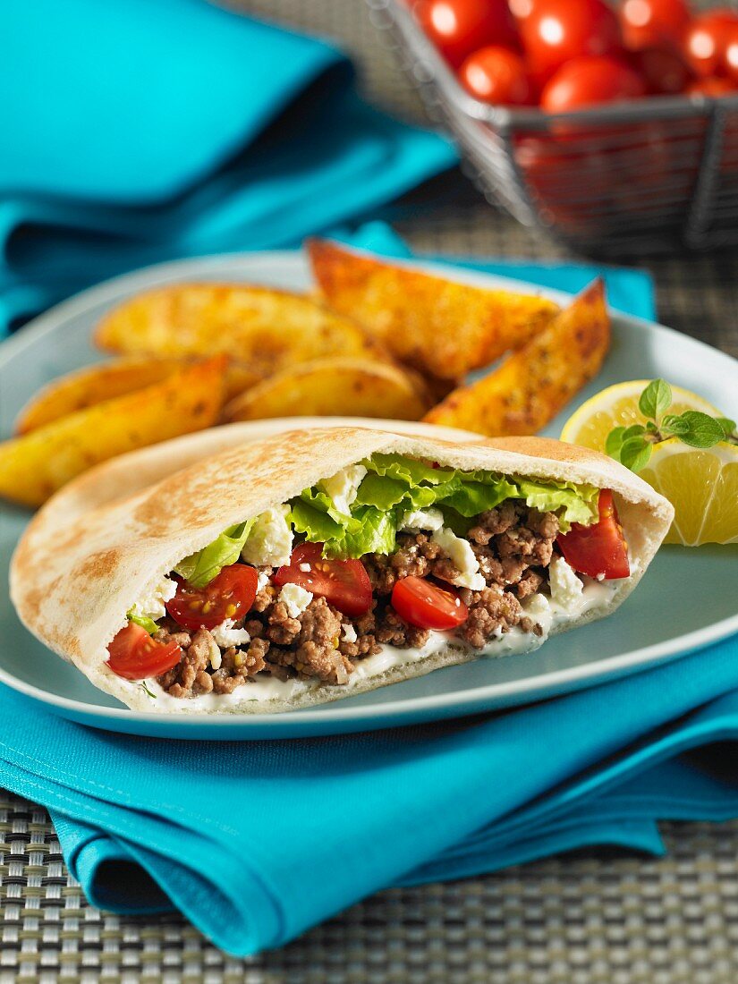 Pita bread filled with minced meat and feta cheese