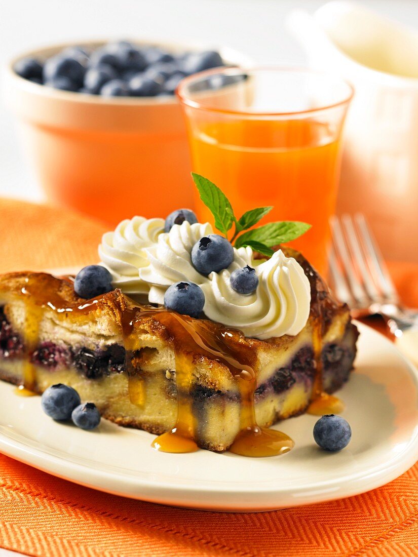 French toast with blueberries, maple syrup and cream