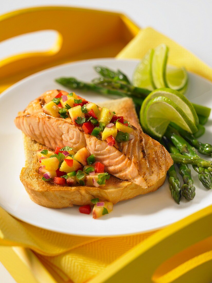 Grilled salmon with peach salsa on toast